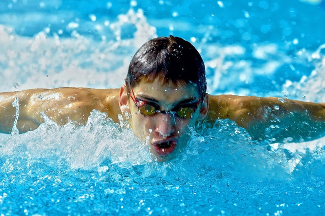 Swimmer_in_waterpool_swim_one_of_swimming_style