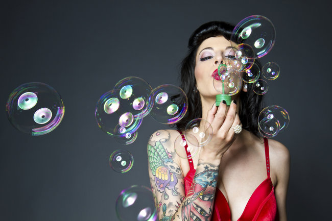 woman_with_tattoo_blowing_bubbles